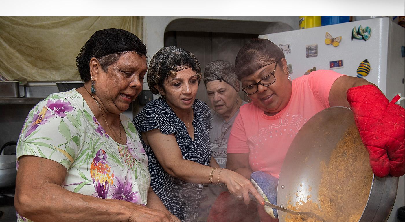 4 women cooking in the kitchen